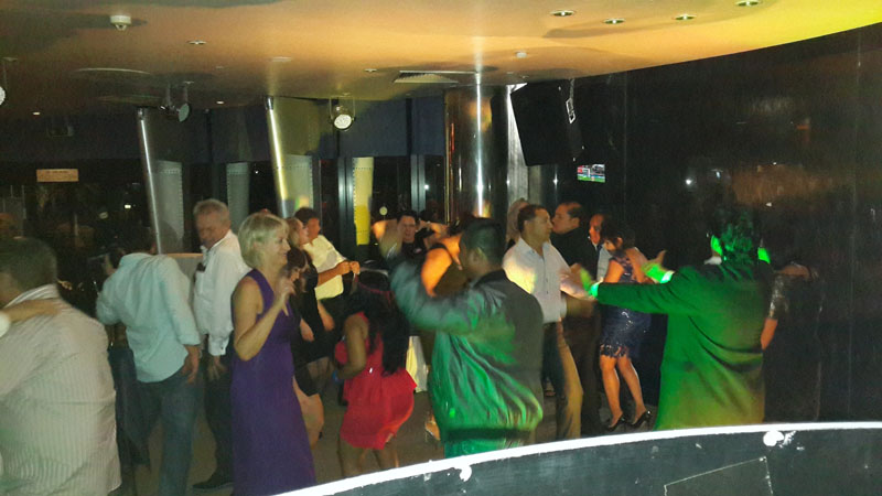 Guests dancing at an evening event