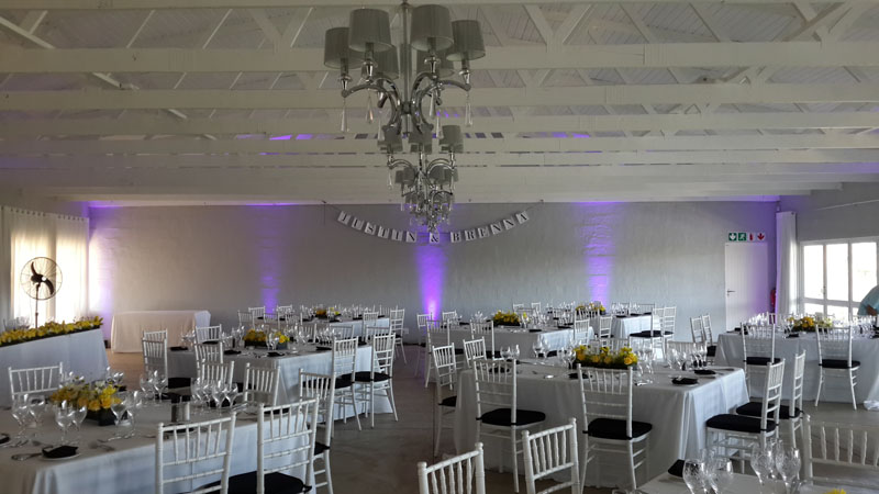 Reception venue prepared with DJ uplighting